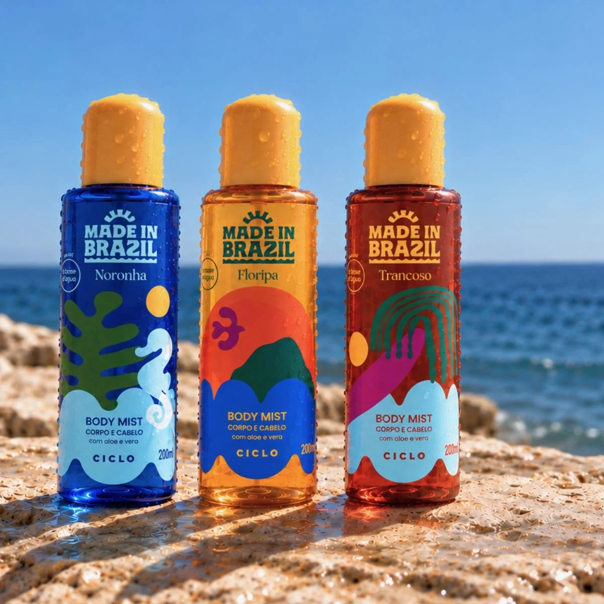 Body mists Noronha, Floripa e Trancoso da linha Made in Brazil da Ciclo em uma pedra na praia